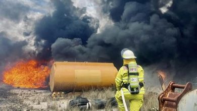 Firefighter extinguishing fire at Vineyard