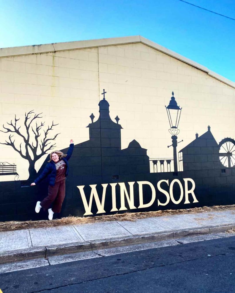Bella Bonazza next to her newly painted mural on Baker Street 