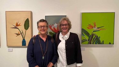 President of Ferry Artists, Carol Gill (left) with artist Hadijah Munting in front of her works featuring recycled coffee pods at the Hawkesbury Now 2024 exhibition